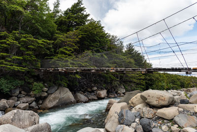 Bridge over river against sky