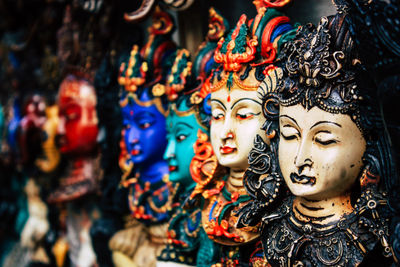 Close-up of statues for sale in market