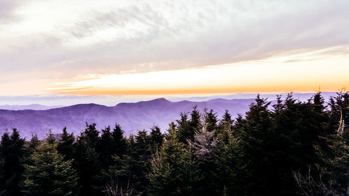 Scenic view of mountains against cloudy sky