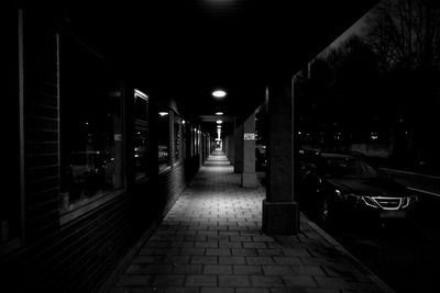 Illuminated empty road at night