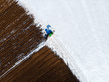 High angle view of umbrella on snowy land
