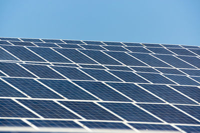 Group of solar panels with blue sky background