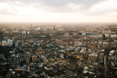 Cityscape against cloudy sky