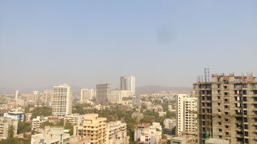 Scenic view of cityscape against sky