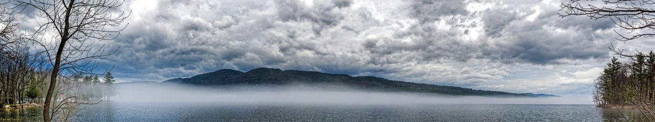 Panoramic view of lake and mountains against sky