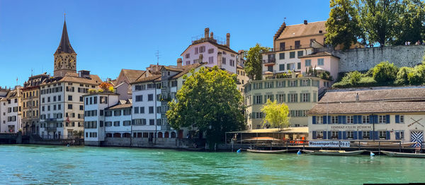 Buildings by river