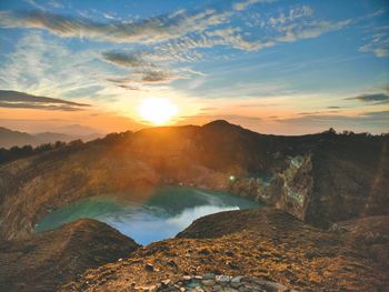 Scenic view of mountains against sky during sunrise