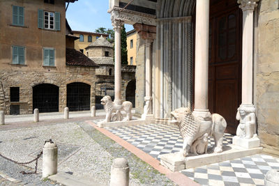 Statue in front of building