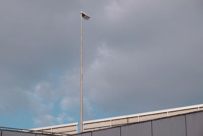 Low angle view of street light against sky