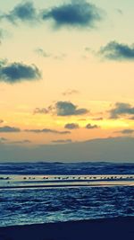 Scenic view of sea at sunset