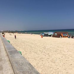 Scenic view of beach against clear sky