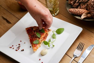 High angle view of person preparing food on table