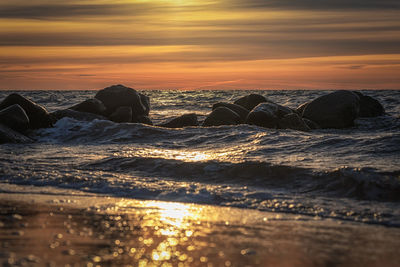 Scenic view of sea against sky during sunset