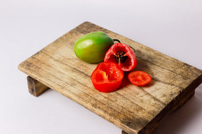 High angle view of tomatoes on cutting board