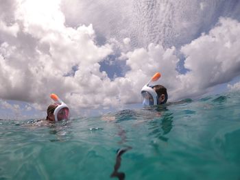 People swimming in sea