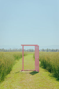 Built structure on field against clear sky