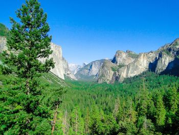 Scenic view of mountains against clear blue sky