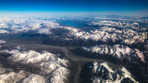 Aerial view of dramatic landscape against sky