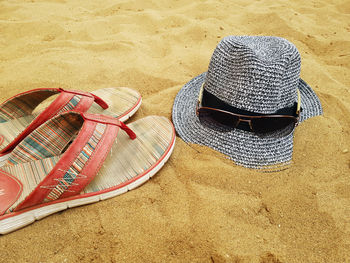 High angle view of sunglasses on sand