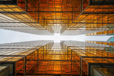 Directly blow shot of modern building against sky