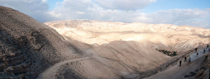 Panoramic view of snowcapped mountains against sky