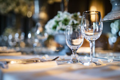 Drinking glass on table in restaurant