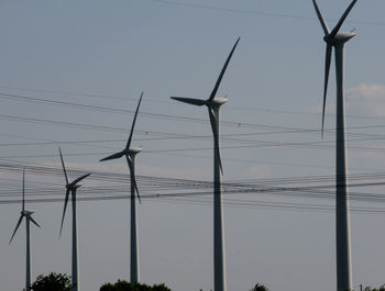 Low angle view of wind turbine against sky