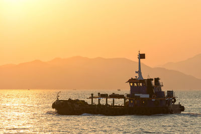 Scenic view of sea against clear sky during sunset