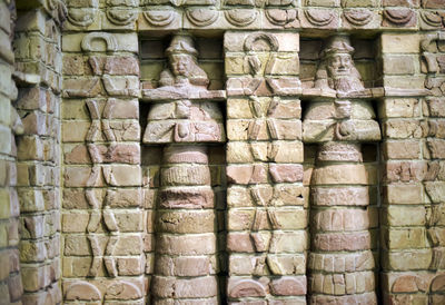 Full frame shot of carvings on wall of building