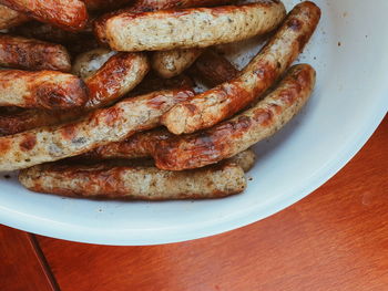 High angle view of sausages in plate on table