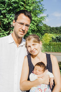 Portrait of happy family outdoors