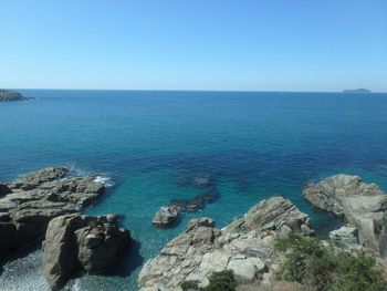 Scenic view of sea against clear blue sky