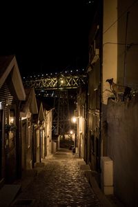 Illuminated street lights in city at night