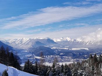 Scenic view of snowcapped mountains against sky