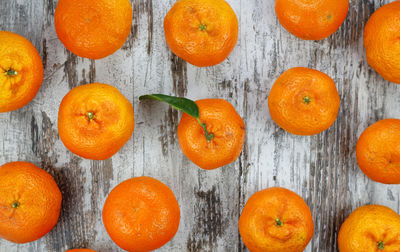 Directly above shot of orange fruits on table