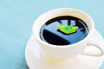 Close-up of coffee cup on table