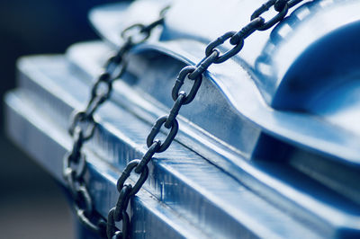 Close-up of chain tied up of metal fence