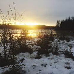 Scenic view of sunset over river