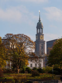 View of tower of building against cloudy sky