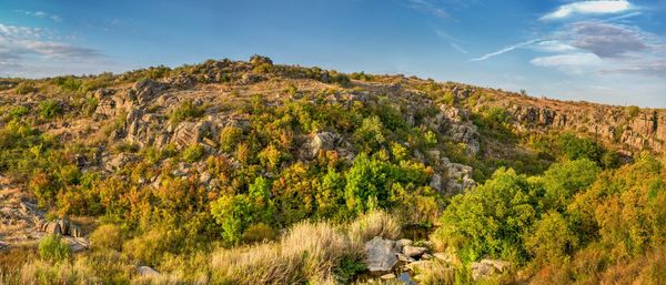 Deep granite canyon with the mertvovod river in aktovo village, ukraine, on a sunny evening