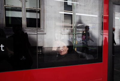 Reflection of man and woman on window