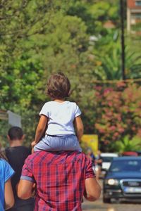 Rear view of man and woman on street