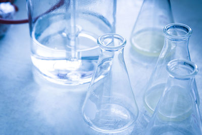 Close-up of beakers on table in laboratory
