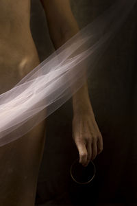 Cropped image of man holding hands