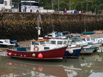 Boats moored at harbor