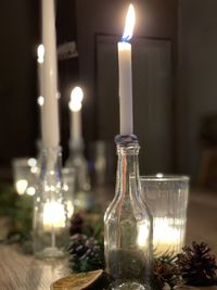 Close-up of illuminated tea light candles on table