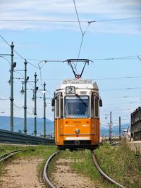 Train on railroad track against sky