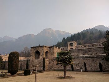 View of castle on mountain against clear sky