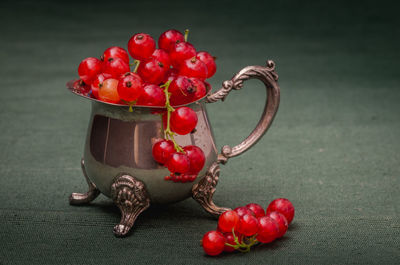 Close-up of red cherries on table