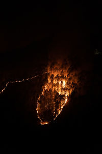 High angle view of firework display at night